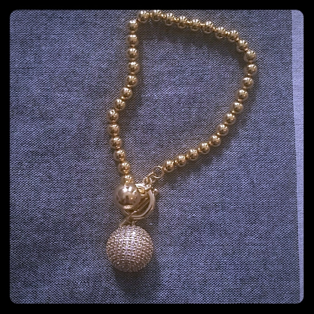 Golden bracelet with crystal ball